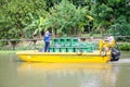 A council bin man on their yellow garbage collection boat in `Sansab` canal.